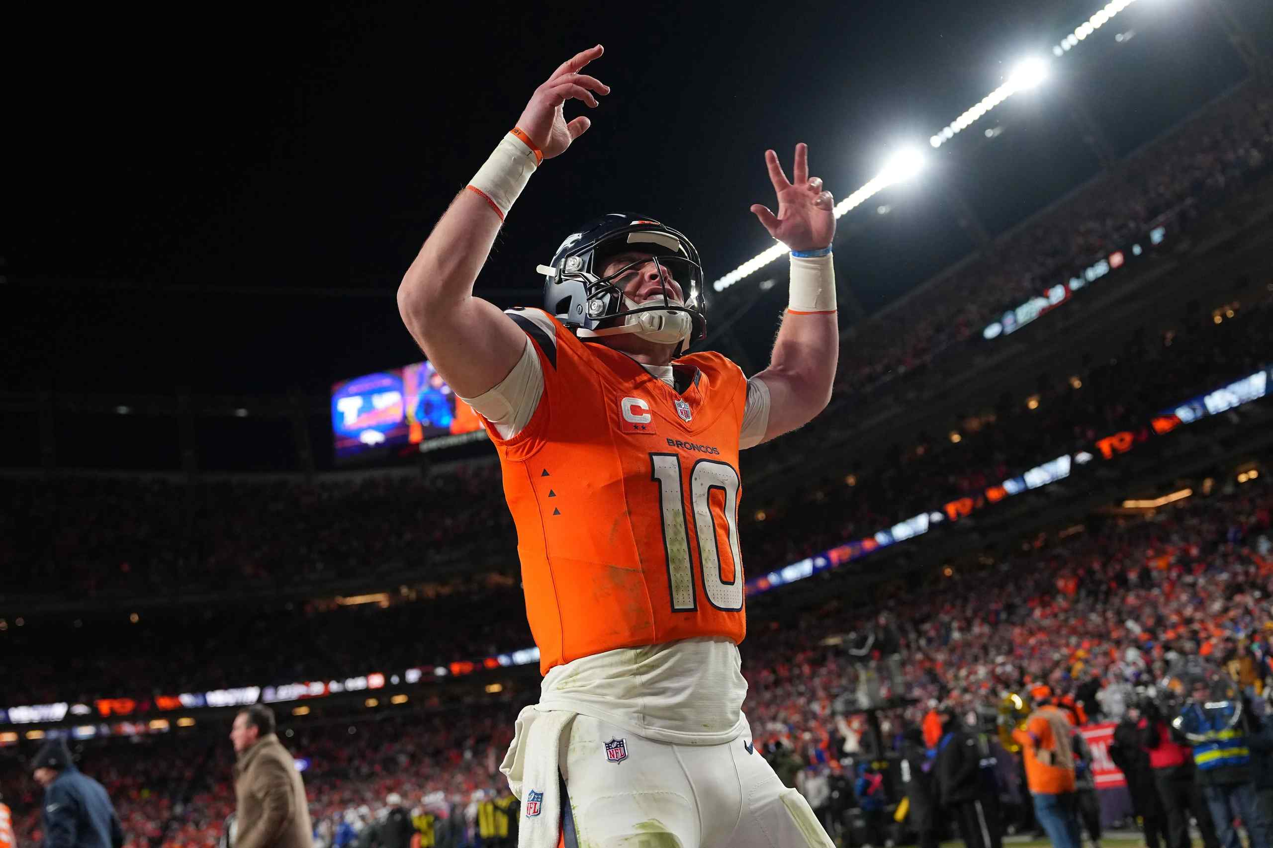 Denver Broncos quarterback Bo Nix celebrating a touchdown.
